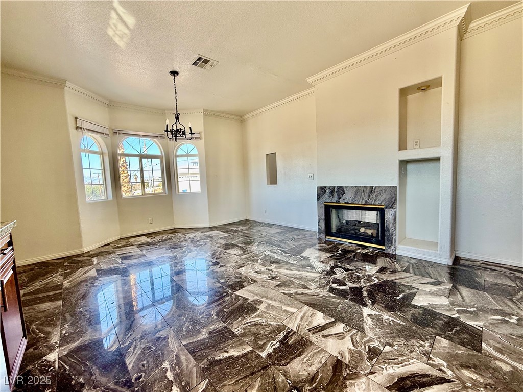 764 Benedict Drive Las Vegas, NV 89110 - Photo 13 of 30 Unfurnished living room with crown molding, a prem
