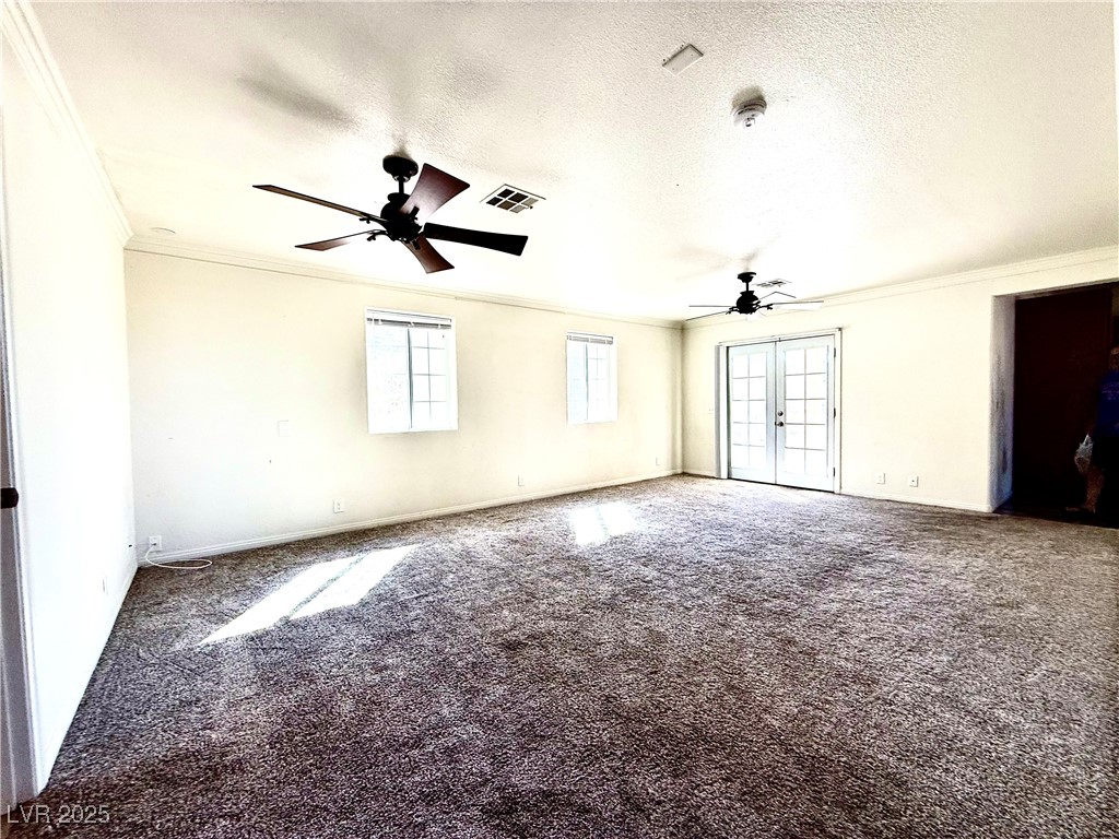 764 Benedict Drive Las Vegas, NV 89110 - Photo 18 of 30 Carpeted spare room with visible vents, a textured