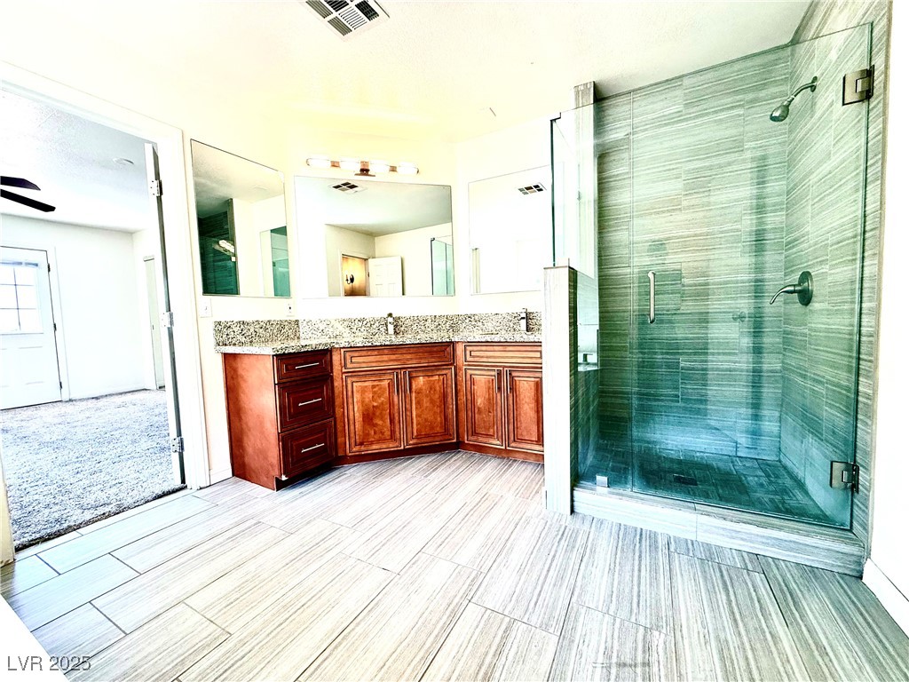 764 Benedict Drive Las Vegas, NV 89110 - Photo 21 of 30 Full bathroom with a sink, visible vents, a stall