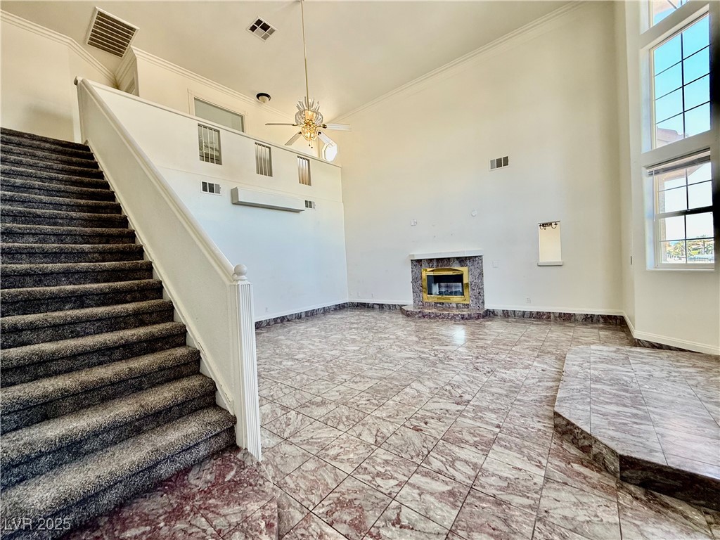 764 Benedict Drive Las Vegas, NV 89110 - Photo 6 of 30 Foyer entrance featuring a towering ceiling, crown