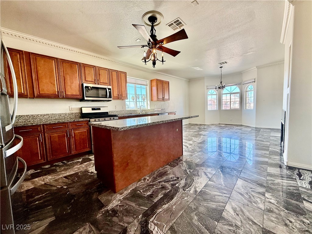 764 Benedict Drive Las Vegas, NV 89110 - Photo 10 of 30 Kitchen with ceiling fan with notable chandelier,