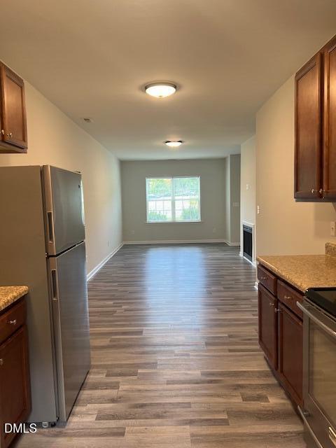 415 Aversboro Road Garner, NC 27529 - Photo 11 of 32 a view of a kitchen center wooden floor and stainless steel appliances