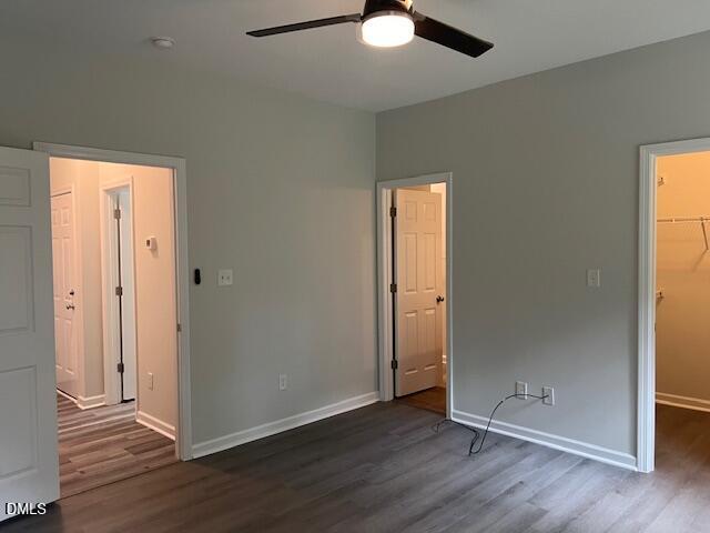 415 Aversboro Road Garner, NC 27529 - Photo 17 of 32 an empty room with wooden floor and a window
