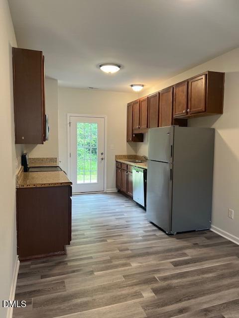 415 Aversboro Road Garner, NC 27529 - Photo 10 of 32 a kitchen with stainless steel appliances a refrigerator stove and microwave