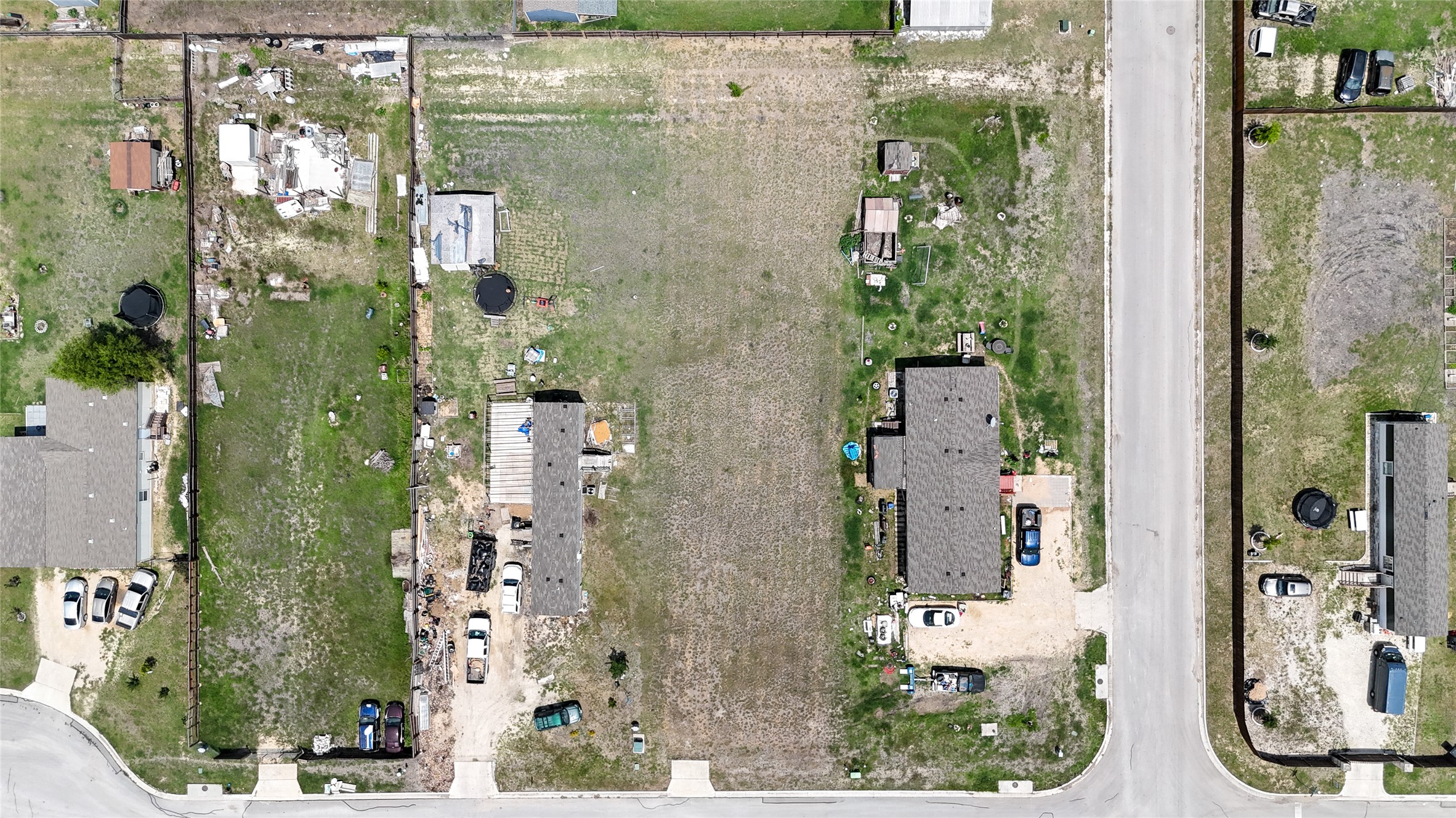 1120 Rustler Pass Kyle, TX 78640 - Photo 7 of 10 an aerial view of a residential apartment building with a yard and large tree