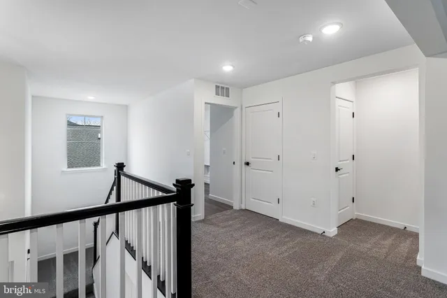 a view of a hallway with front door