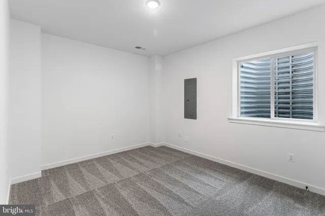 a view of a room that has a window in it