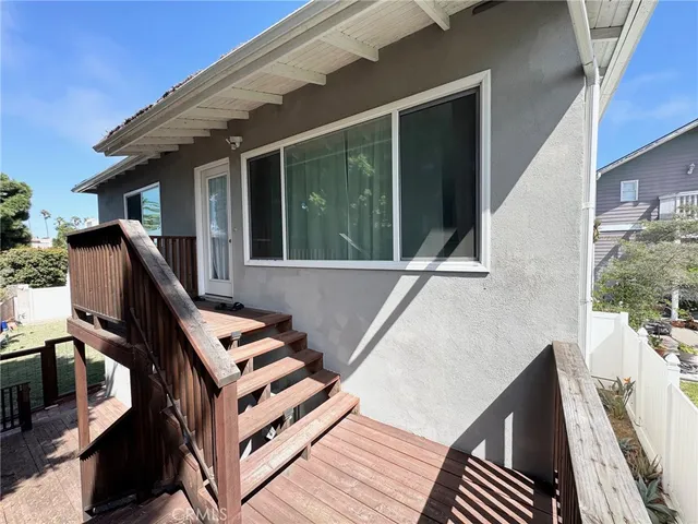 a view of a house with backyard and wooden floor