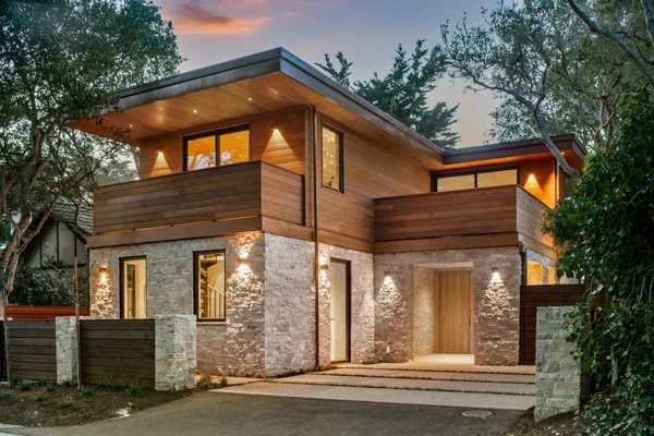 a view of a house with a window and tree