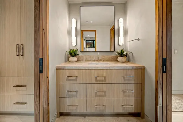 a bedroom with a bed and a table in it