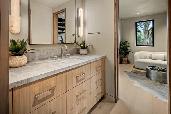 a bedroom with a bed and a mirror