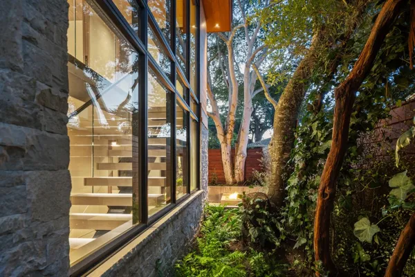 a front view of a house with garden