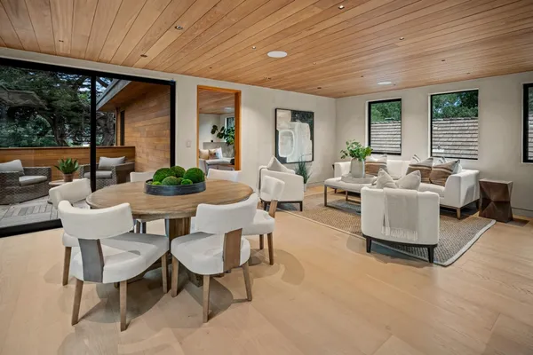 a dining room with furniture and window