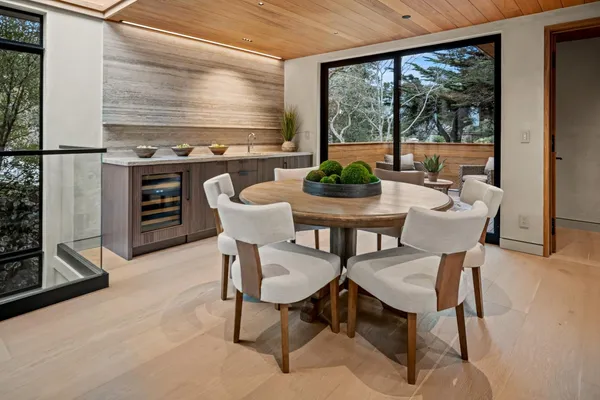 a dining room with a table and chairs