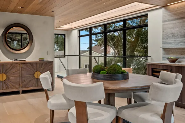 a dining room with furniture and window