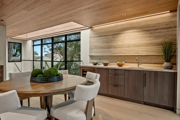 a kitchen with a table and chairs in it