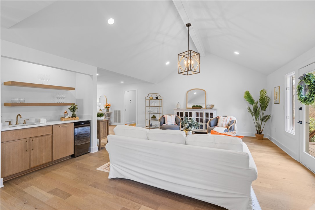 117 Riverpoint Drive Clemson, SC 29631 - Photo 14 of 47 This bright living area features vaulted ceilings and light wood floors, creating an inviting atmosphere.