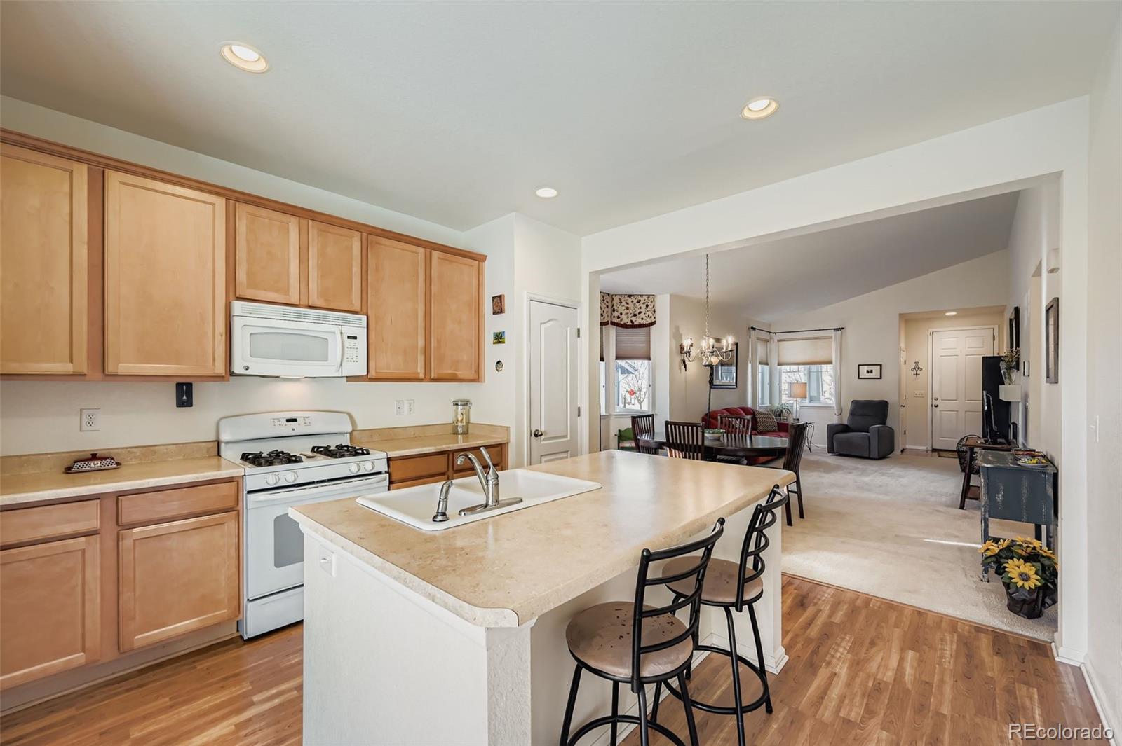 4712 Sandy Ridge Avenue Firestone, CO 80504 - Photo 11 of 29 a kitchen with a sink stove and cabinets