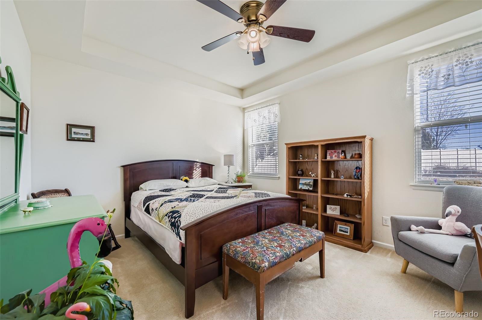 4712 Sandy Ridge Avenue Firestone, CO 80504 - Photo 14 of 29 a bedroom with a bed and a chandelier
