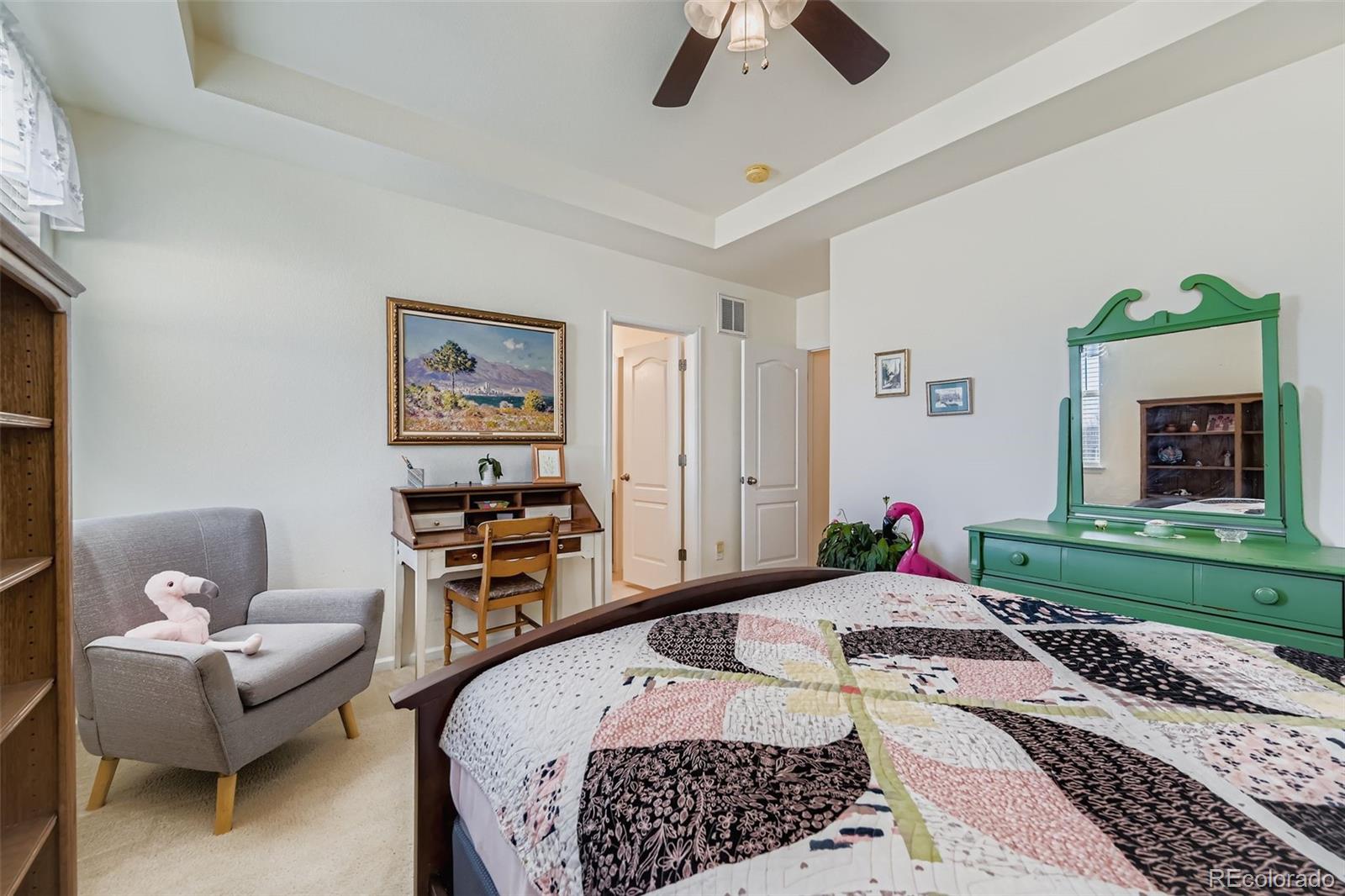 4712 Sandy Ridge Avenue Firestone, CO 80504 - Photo 15 of 29 a bedroom with a bed and a couch