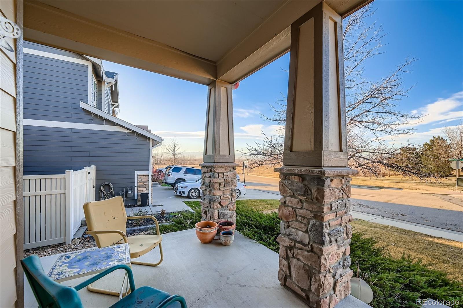 4712 Sandy Ridge Avenue Firestone, CO 80504 - Photo 4 of 29 a view of a patio with table and chairs and potted plants