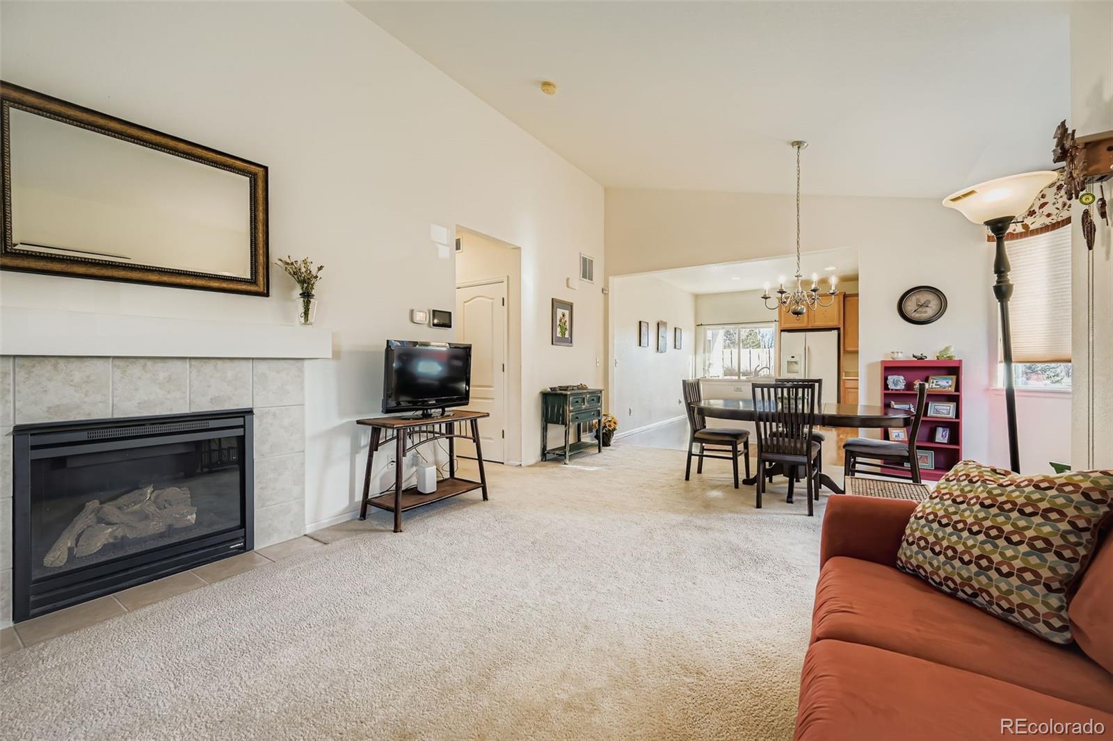 4712 Sandy Ridge Avenue Firestone, CO 80504 - Photo 8 of 29 a living room with furniture and a fireplace