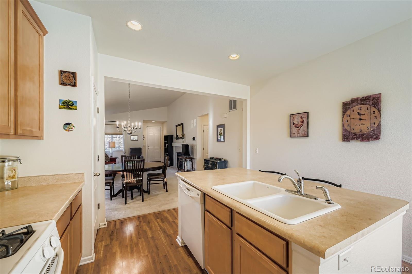 4712 Sandy Ridge Avenue Firestone, CO 80504 - Photo 10 of 29 a view of living room with granite countertop furniture and wooden floor