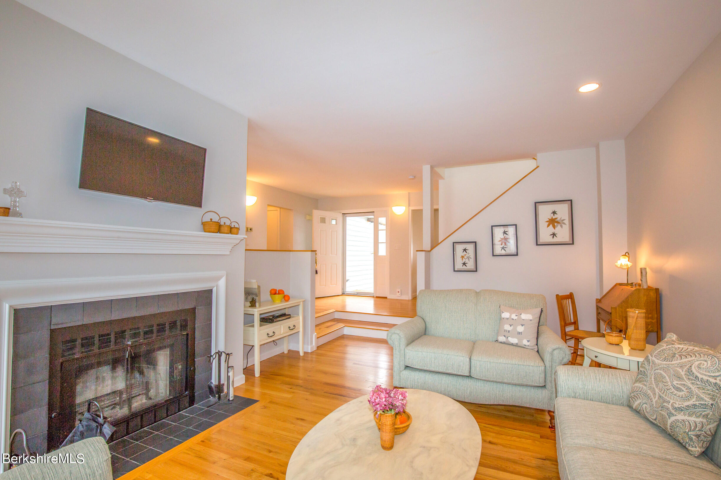 1136 Barker Road, Unit 9 Pittsfield, MA 01201 - Photo 1 of 60 a living room with furniture and a fireplace