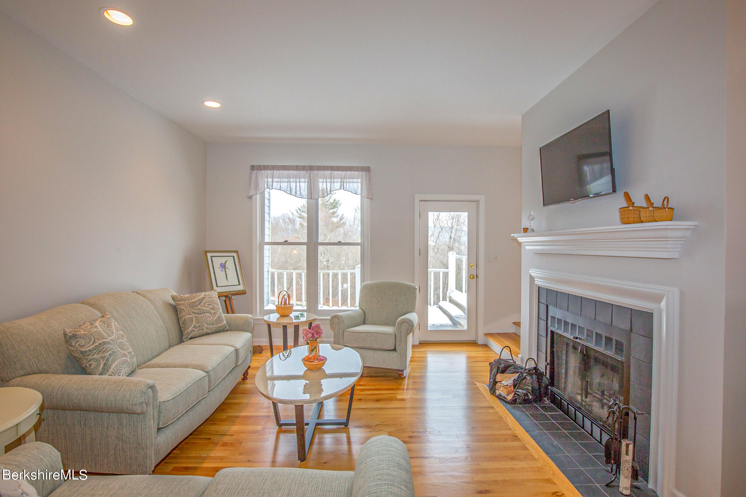 1136 Barker Road, Unit 9 Pittsfield, MA 01201 - Photo 11 of 60 a living room with fireplace furniture and a fireplace