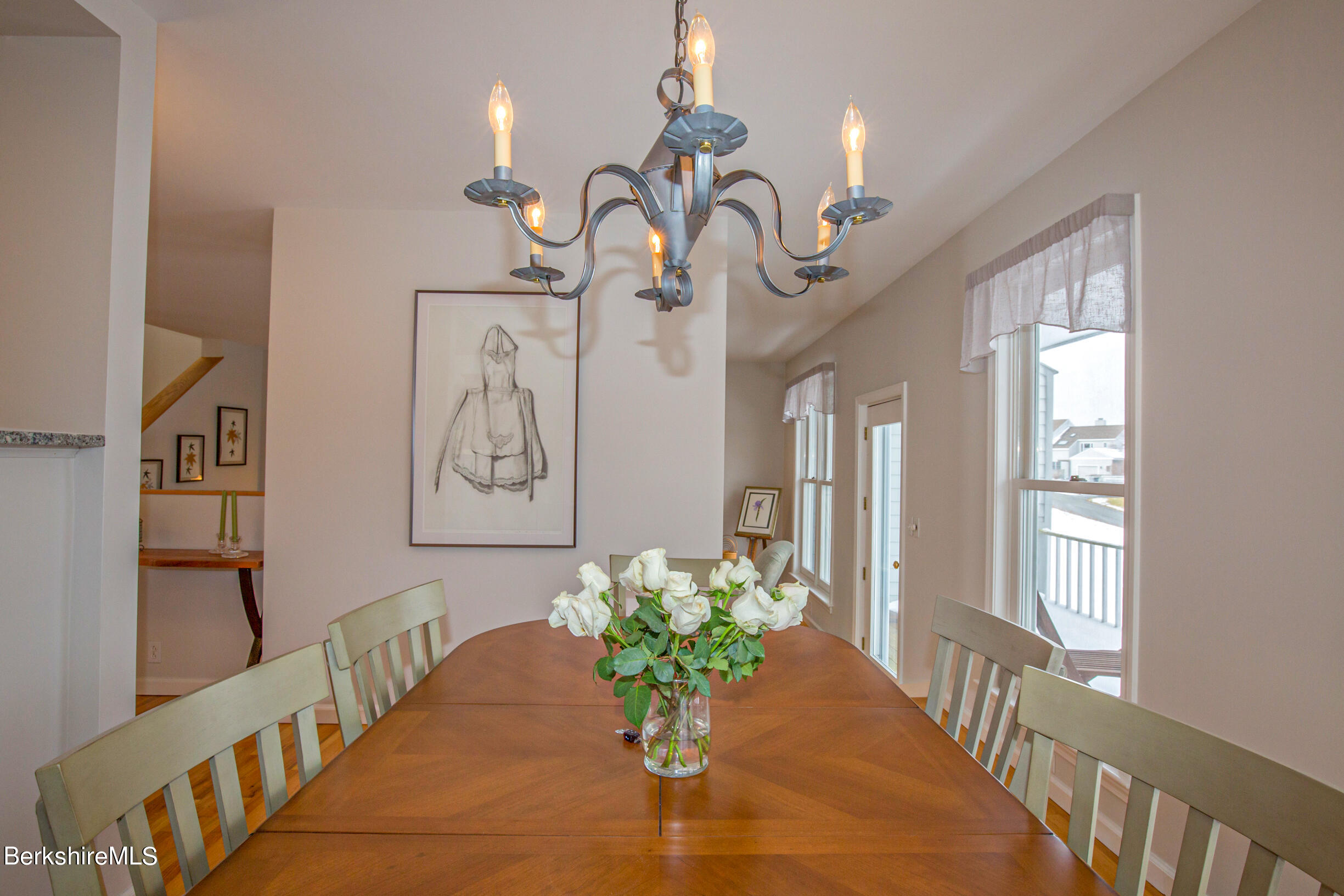 1136 Barker Road, Unit 9 Pittsfield, MA 01201 - Photo 18 of 60 a vase of flowers sitting on a table with a window