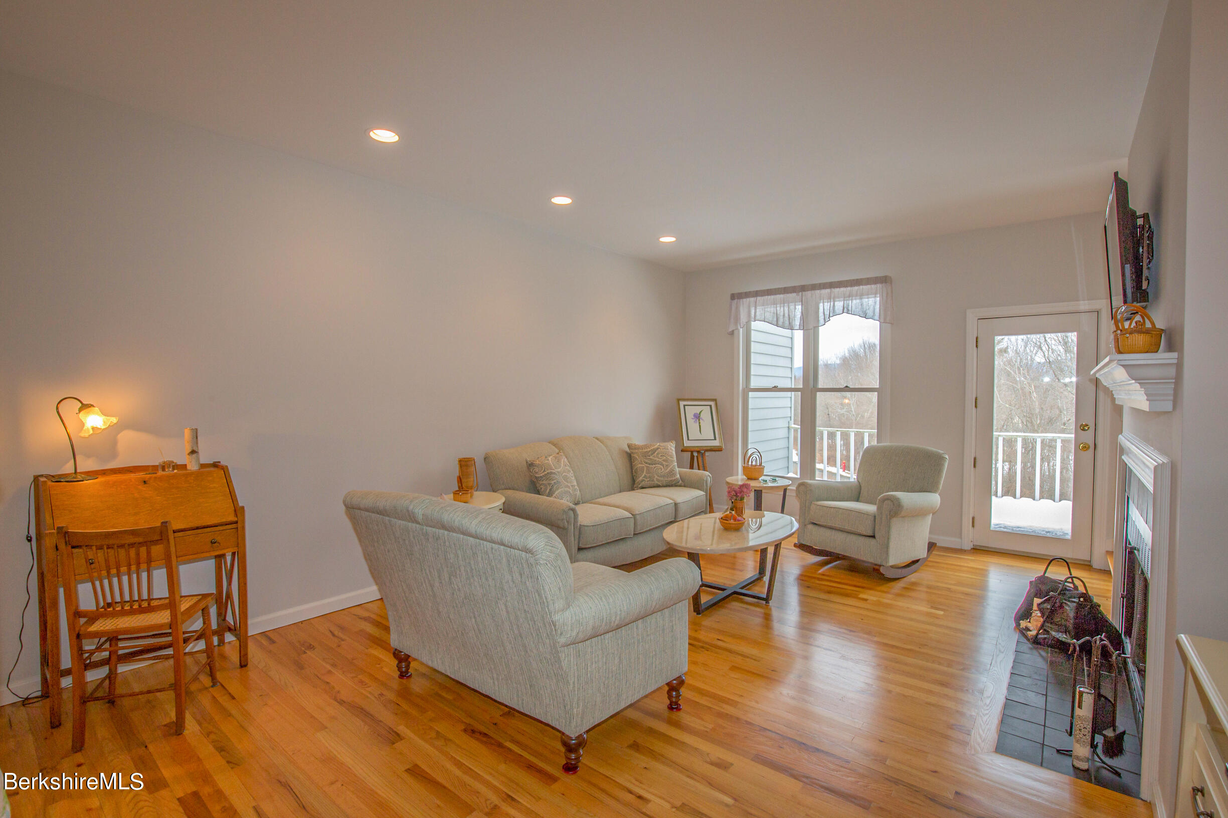 1136 Barker Road, Unit 9 Pittsfield, MA 01201 - Photo 21 of 60 a living room with furniture and wooden floor