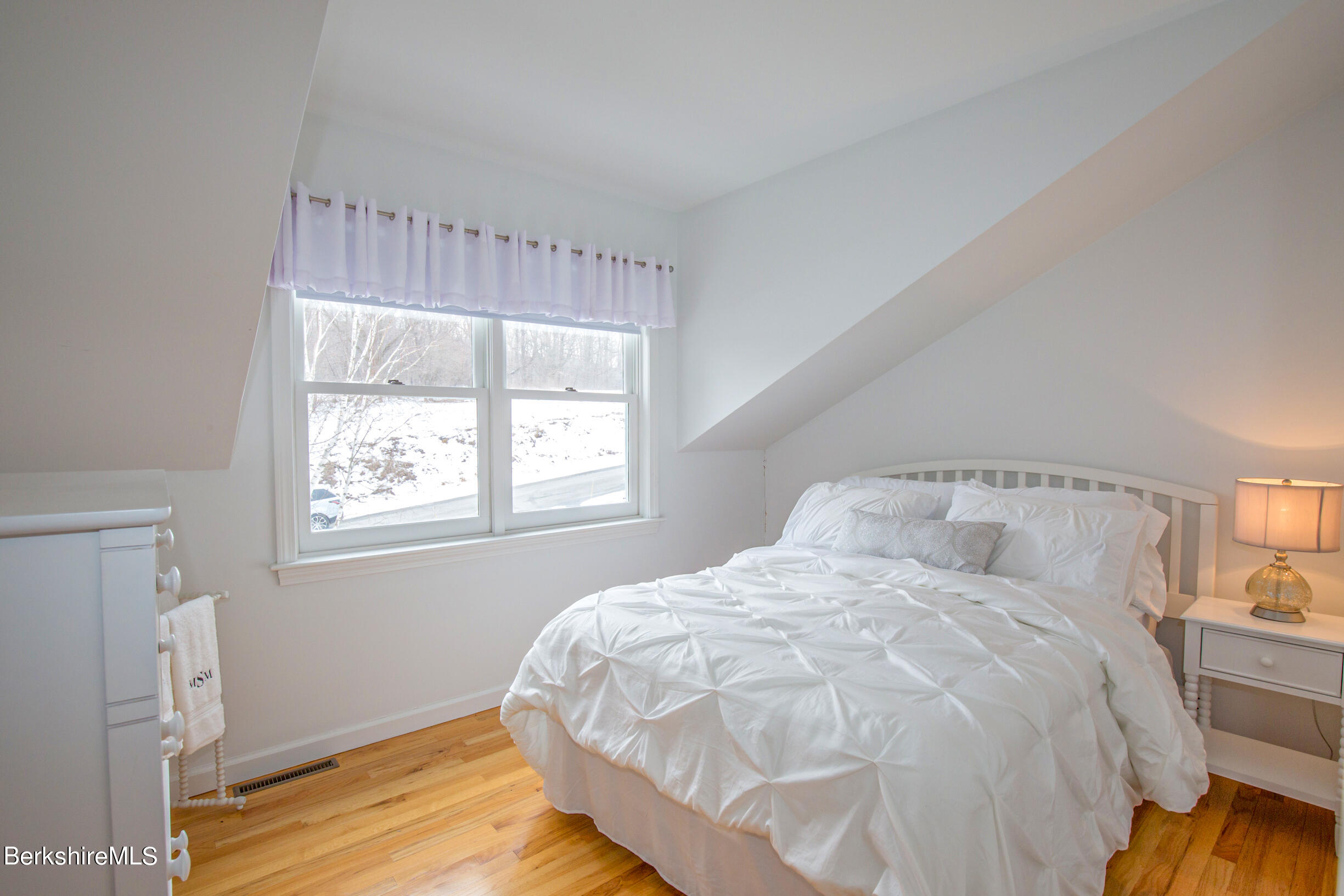 1136 Barker Road, Unit 9 Pittsfield, MA 01201 - Photo 23 of 60 a large bed sitting in a bedroom next to a window