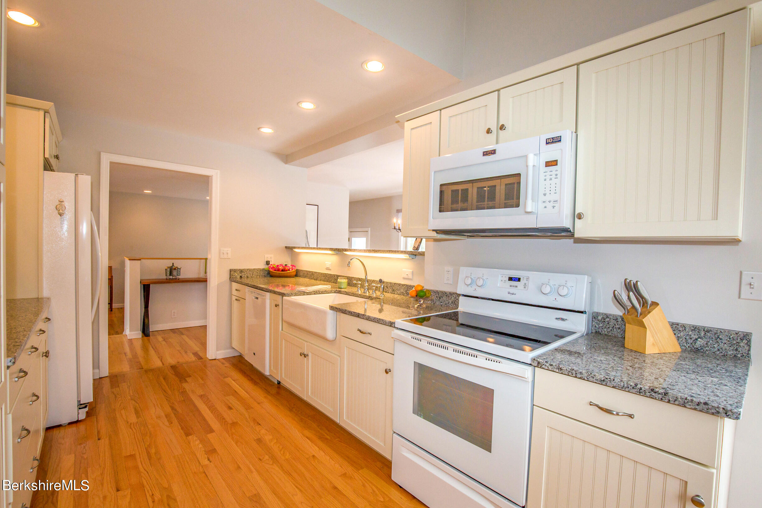 1136 Barker Road, Unit 9 Pittsfield, MA 01201 - Photo 4 of 60 a kitchen with stainless steel appliances granite countertop a sink and cabinets