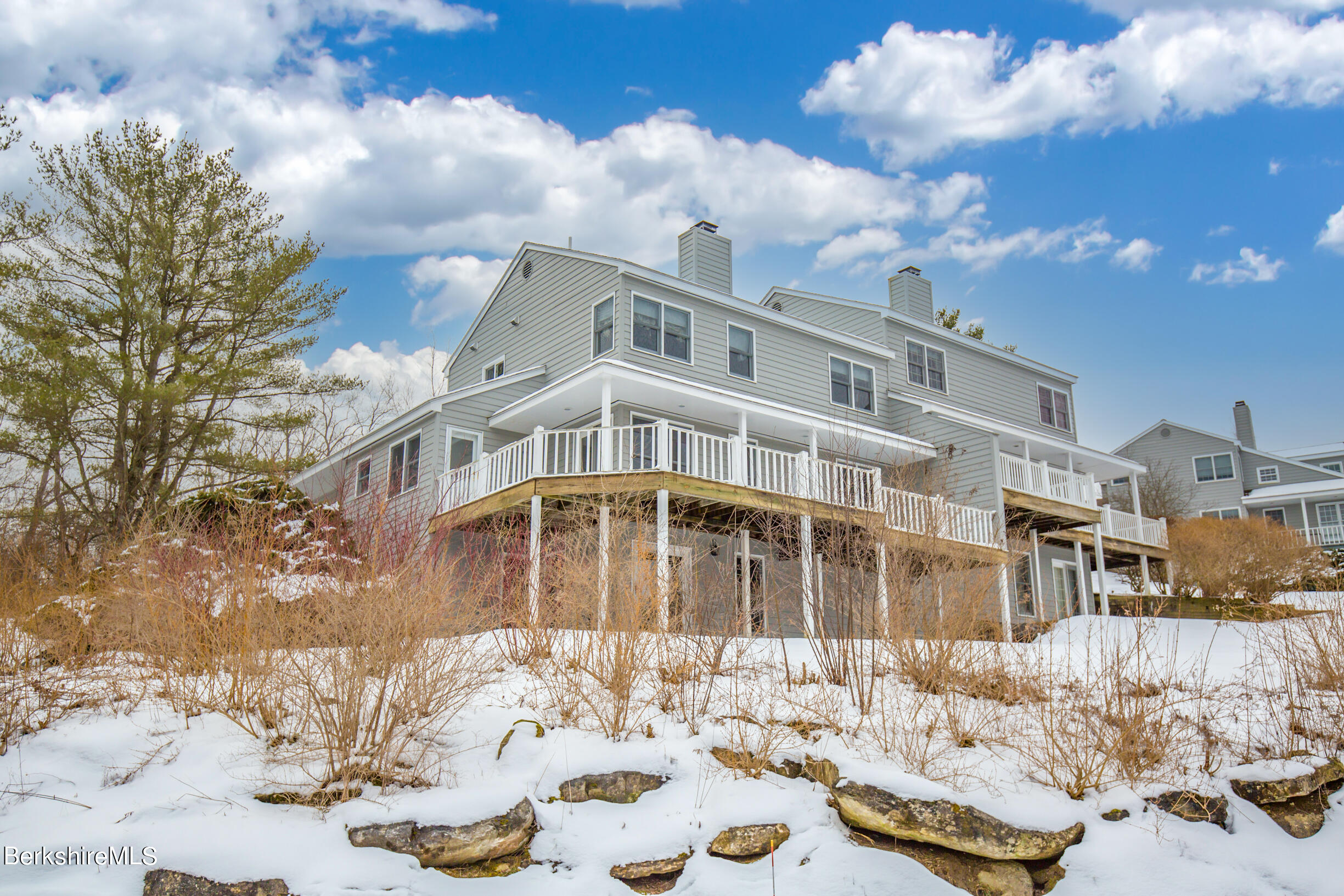 1136 Barker Road, Unit 9 Pittsfield, MA 01201 - Photo 47 of 60 a front view of a house with a yard