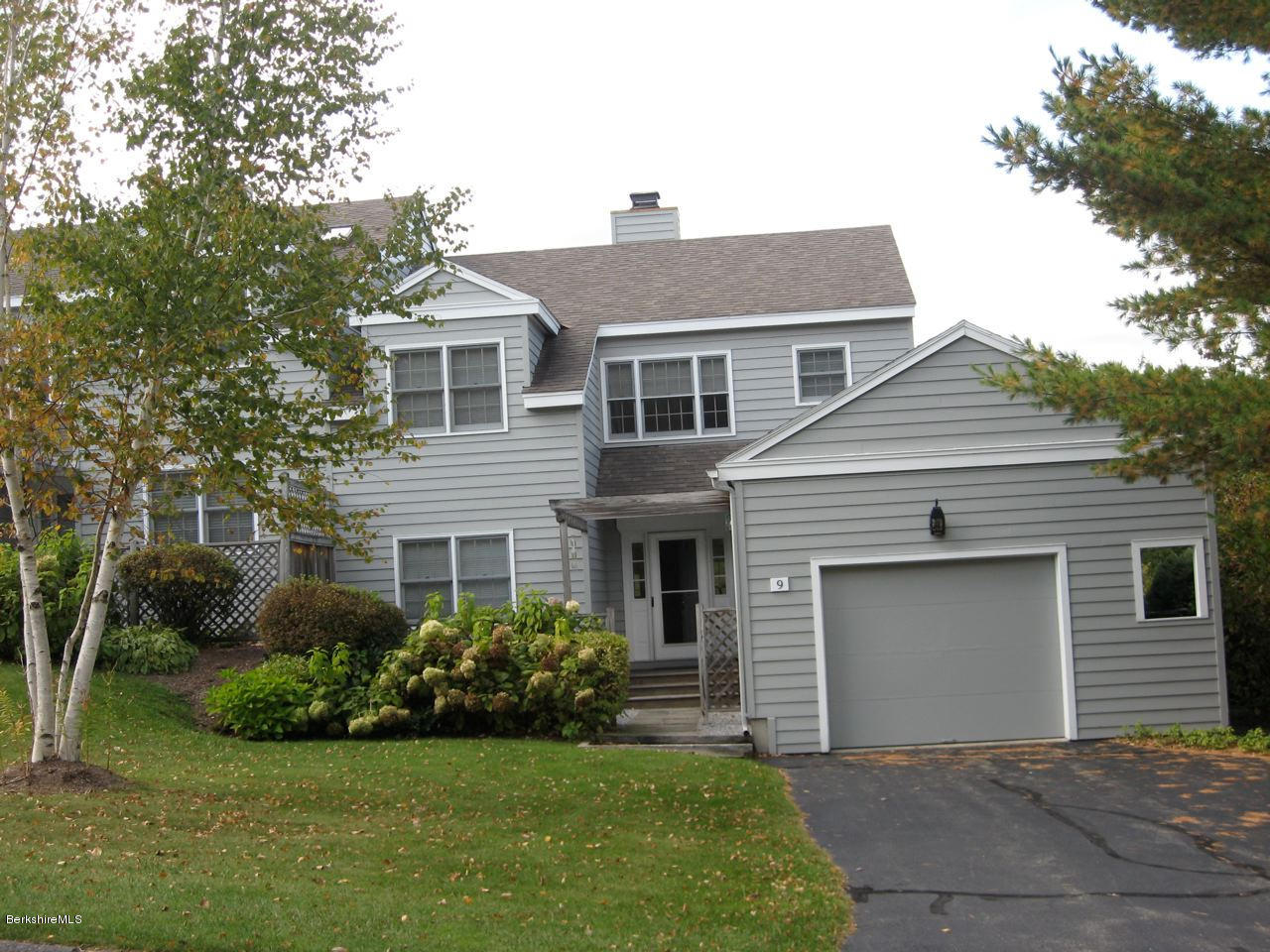 1136 Barker Road, Unit 9 Pittsfield, MA 01201 - Photo 49 of 60 a front view of a house with a garden
