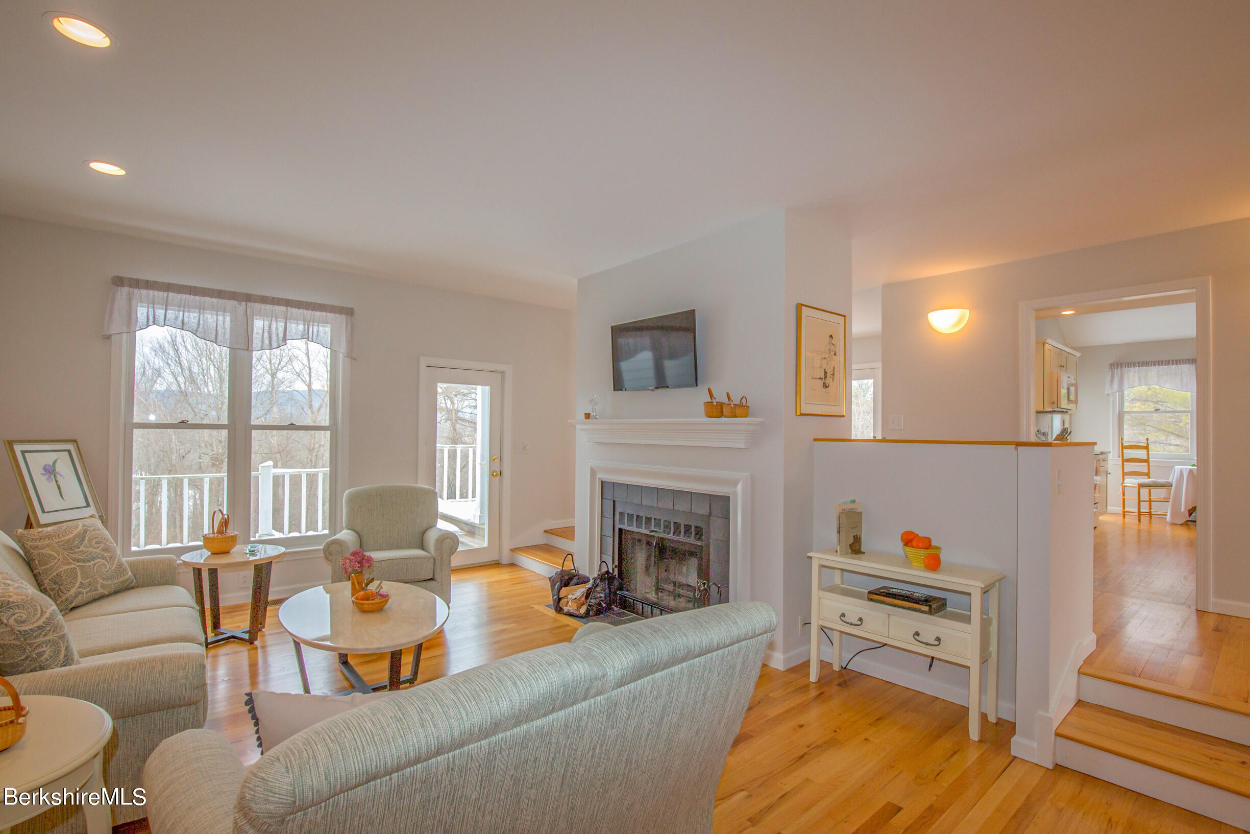 1136 Barker Road, Unit 9 Pittsfield, MA 01201 - Photo 5 of 60 a living room with furniture fireplace and a table