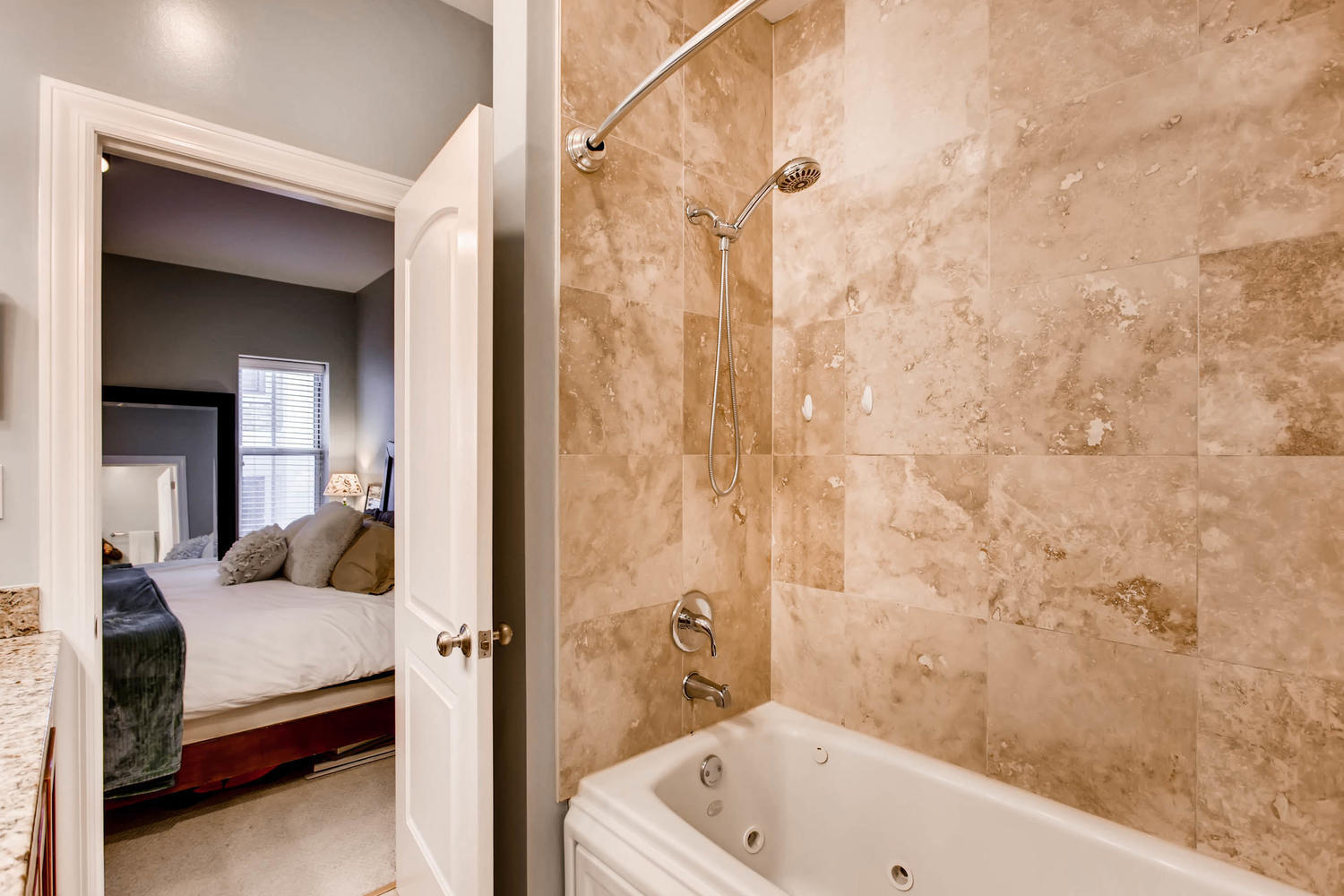 1242 West Pratt Boulevard, Unit 3F Chicago, IL 60626 - Photo 18 of 30 a bathroom with a tub and shower