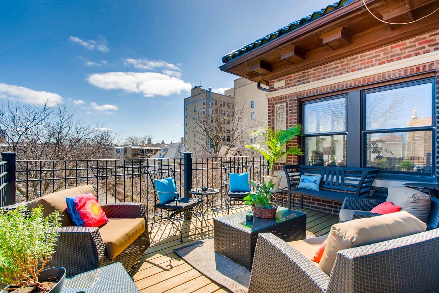 1242 West Pratt Boulevard, Unit 3F Chicago, IL 60626 - Photo 21 of 30 a roof deck with couch and chairs