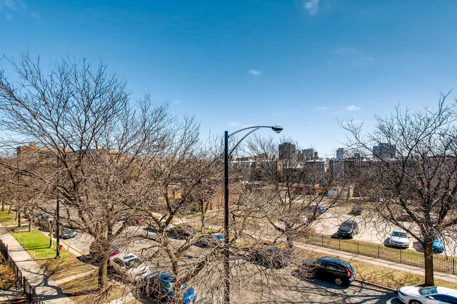 1242 West Pratt Boulevard, Unit 3F Chicago, IL 60626 - Photo 26 of 30 a city view with tall trees