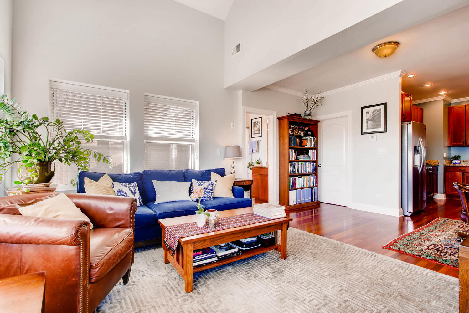 1242 West Pratt Boulevard, Unit 3F Chicago, IL 60626 - Photo 5 of 30 a living room with furniture and a book shelf