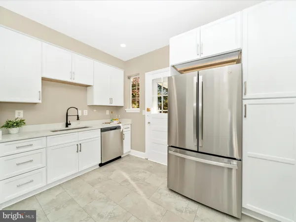 a view of a dining room with furniture and a window
