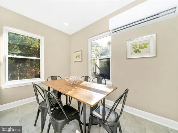 a dining room with a table and chairs