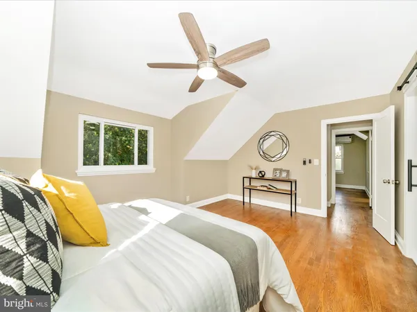 a view of room with window and hardwood floor