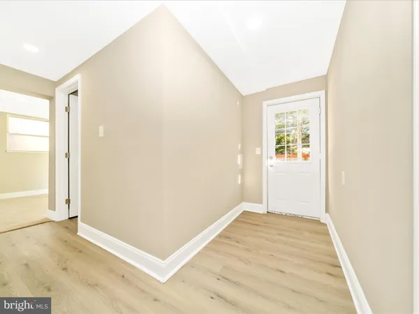 a bathroom with a sink toilet and a mirror