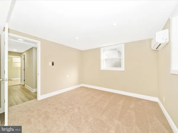 a view of a yard with wooden fence