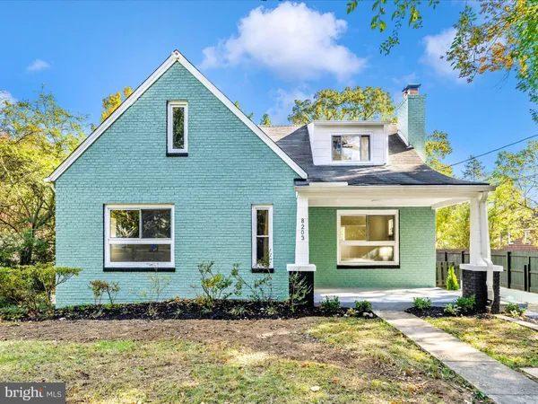 a view of a patio with a table and chairs