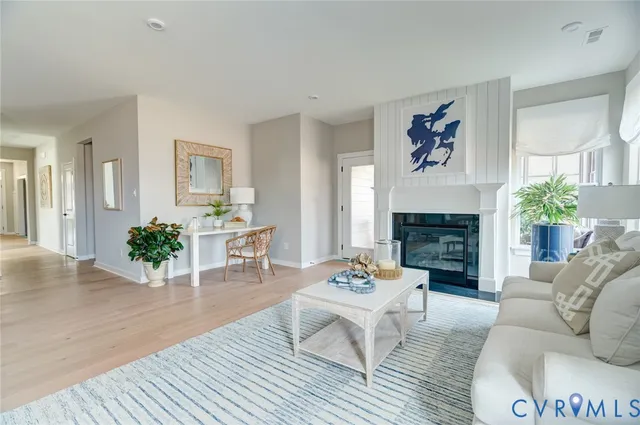 a kitchen with kitchen island a stove a table and chairs in it