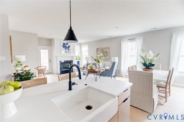 a living room with lots of furniture and wooden floor