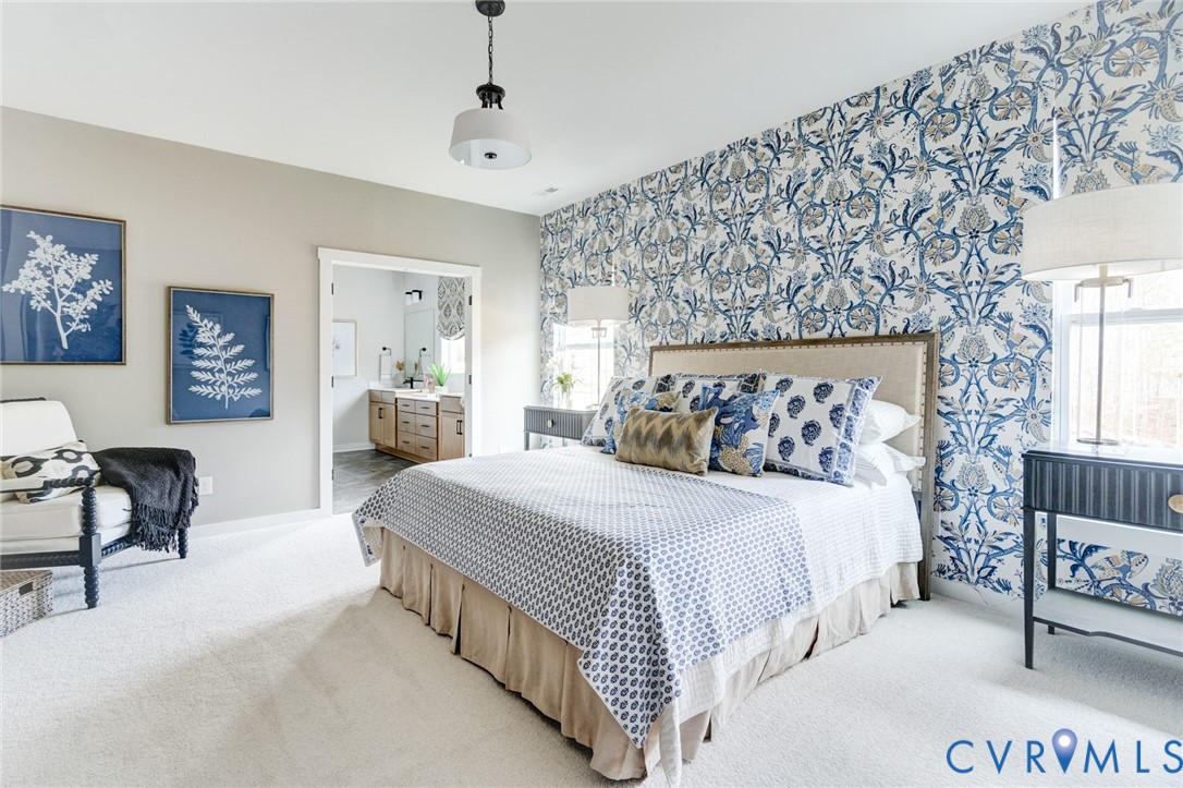 0 Canoe Pointe Loop, Unit 995 Henrico, VA 23238 - Photo 2 of 31 a bedroom with a bed and lamp