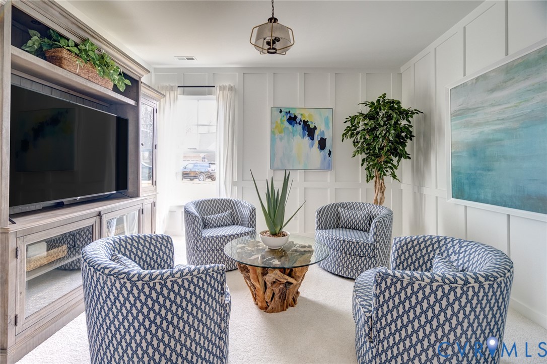 0 Canoe Pointe Loop, Unit 995 Henrico, VA 23238 - Photo 25 of 31 a living room with furniture a flat screen tv and a fireplace